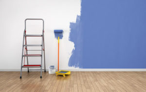 wall half painted with blue color paint